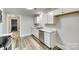 Bright kitchen featuring white cabinets, stainless steel appliances, and marble countertops at 2478 Stribling Cir, Lancaster, SC 29720