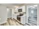 Modern kitchen featuring stainless steel appliances, marble countertops, and bright white cabinetry at 2478 Stribling Cir, Lancaster, SC 29720