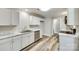 Well-lit kitchen featuring white cabinets, stainless steel appliances, and marble countertops at 2478 Stribling Cir, Lancaster, SC 29720