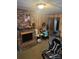 A second view of the living room featuring wood paneling and a fireplace at 3050 Millstone Dr, Gastonia, NC 28054