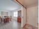 Sunlit dining room featuring classic wooden furniture and a built-in china cabinet at 306 Stevens St, Monroe, NC 28112