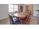 Cozy dining room with a wooden table, chairs, and ample natural light at 306 Stevens St, Monroe, NC 28112