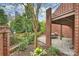 Enjoy a backyard brick patio, landscaping, and a brick exterior at 309 Settlers Ln, Charlotte, NC 28202