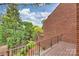 View from the deck of a verdant fenced backyard at 309 Settlers Ln, Charlotte, NC 28202