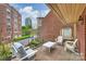 Relax on the balcony with lovely views of neighboring brick buildings at 309 Settlers Ln, Charlotte, NC 28202