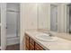 Bathroom featuring a shower, vanity, large mirror, and white countertops at 309 Settlers Ln, Charlotte, NC 28202