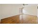 This bedroom has hardwood floors, bright walls, and a window at 309 Settlers Ln, Charlotte, NC 28202