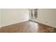 Bedroom with tile floor, neutral walls, and a private entrance to the backyard at 309 Settlers Ln, Charlotte, NC 28202