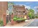 Charming brick townhome featuring a gated entrance, balcony, and a one-car garage, nestled in a desirable community at 309 Settlers Ln, Charlotte, NC 28202