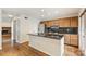 The kitchen features dark countertops, stainless steel appliances, and hardwood floors at 309 Settlers Ln, Charlotte, NC 28202