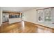 Open kitchen and living area with hardwood floors, stainless steel appliances, and ample natural light at 309 Settlers Ln, Charlotte, NC 28202