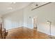 Open living space with soaring ceilings, hardwood floors, fireplace, and a large open area perfect for entertaining at 309 Settlers Ln, Charlotte, NC 28202