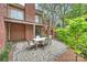 Inviting brick patio with outdoor table and chairs, perfect for entertaining or relaxing at 309 Settlers Ln, Charlotte, NC 28202