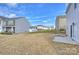 View of home backyard with grass at 4010 Richard Andrew Dr, Matthews, NC 28105