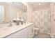 Bathroom with double sinks, patterned shower curtain, and vanity at 4010 Richard Andrew Dr, Matthews, NC 28105