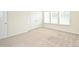 Bright bedroom with large windows, neutral walls, carpet, and double closet at 4010 Richard Andrew Dr, Matthews, NC 28105