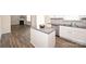 Kitchen with an island, stainless steel appliances, and a view of the adjacent living area at 4010 Richard Andrew Dr, Matthews, NC 28105