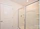 Shower features a clear glass door and built-in shelves at 4010 Richard Andrew Dr, Matthews, NC 28105
