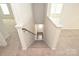 Carpeted staircase leading to the front door and upper level at 4010 Richard Andrew Dr, Matthews, NC 28105