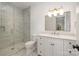 Chic bathroom featuring walk-in shower, modern vanity with a stone countertop, and stylish lighting at 4012 Nettie Ct # 5, Charlotte, NC 28211