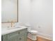 Stylish powder room featuring modern fixtures, custom vanity, and hardwood floors at 4012 Nettie Ct # 5, Charlotte, NC 28211