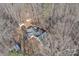 Birds eye view of a home surrounded by a forest, a gazebo, and outbuildings at 530 Wilmot Trl, Gastonia, NC 28056