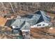 Aerial view of a house with a grey roof, wooden gazebo, and an outdoor patio at 530 Wilmot Trl, Gastonia, NC 28056