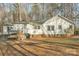 The backyard features a swing, a wooden patio, and well-maintained landscaping at 530 Wilmot Trl, Gastonia, NC 28056
