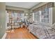 Cozy bedroom with natural light, hardwood floors, and a view of the surrounding trees at 530 Wilmot Trl, Gastonia, NC 28056
