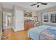 Bright bedroom features hardwood floors, natural light, ceiling fan, and vanity at 530 Wilmot Trl, Gastonia, NC 28056
