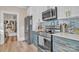 Well-equipped kitchen with stainless steel appliances, stylish backsplash, and ample storage space at 530 Wilmot Trl, Gastonia, NC 28056