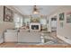 A spacious living room boasting a fireplace, a large couch, and natural light at 530 Wilmot Trl, Gastonia, NC 28056