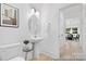 Modern half bathroom with pedestal sink, round mirror, and stylish fixtures at 680 Candela Ct # 52, York, SC 29745