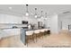 Open-concept kitchen with island seating, stainless steel appliances, and lots of white cabinets and countertops at 680 Candela Ct # 52, York, SC 29745