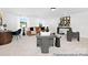 Open concept living room with large sunny windows, neutral walls, and carpet flooring at 680 Candela Ct # 52, York, SC 29745