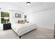 Bright main bedroom features neutral decor, plush carpet, and natural light from windows at 680 Candela Ct # 52, York, SC 29745