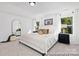 Bright main bedroom features neutral decor, plush carpet, and natural light from windows at 680 Candela Ct # 52, York, SC 29745