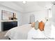 This main bedroom offers a tray ceiling, black dresser, arched mirror, and bedside lighting at 680 Candela Ct # 52, York, SC 29745