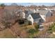 Aerial view of a home with a well-maintained lawn and a charming neighborhood setting at 7007 Church Wood Ln, Huntersville, NC 28078