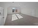 Spacious bedroom with neutral carpeting, natural light from windows, and access door at 7007 Church Wood Ln, Huntersville, NC 28078