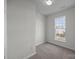 Neutral bedroom with plush carpeting and natural light from the window at 7007 Church Wood Ln, Huntersville, NC 28078