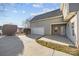 Attached garage with driveway and manicured landscaping on a sunny day at 7007 Church Wood Ln, Huntersville, NC 28078