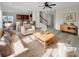 Stylish living room featuring a plush rug, comfortable seating, and an open layout with a bar counter at 7007 Church Wood Ln, Huntersville, NC 28078