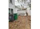 An open backyard with a lattice fence and access to the back of the home at , Charlotte, NC 28227