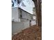 View of the side exterior of home at 7107, partially hidden behind a large tree, and fenced in yard at , Charlotte, NC 28227