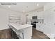 Modern kitchen with a large island, stainless steel appliances, and hardwood floors at 7921 Old Brook Rd, Sherrills Ford, NC 28673