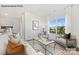 Bright living room with large window, neutral palette, stylish rug and comfortable seating arrangement at 7921 Old Brook Rd, Sherrills Ford, NC 28673