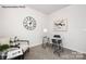 Bright home office with comfortable seating, minimalist decor, and neutral carpet at 7921 Old Brook Rd, Sherrills Ford, NC 28673