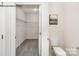 Spacious walk-in closet with metal shelving and neutral carpet at 7921 Old Brook Rd, Sherrills Ford, NC 28673