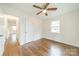 Bedroom boasts hardwood floors, a ceiling fan, and natural light at 901 Yellowstone Dr, Charlotte, NC 28208